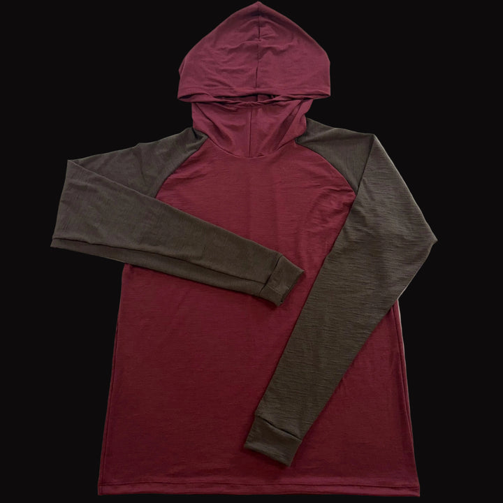 A long-sleeve merino wool hooded shirt featuring a burgundy body and hood with brown sleeves.