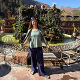 Betsy Cassell-Thomas owner of Intertwined Designs wearing a merino wool shirt in Morocco while traveling